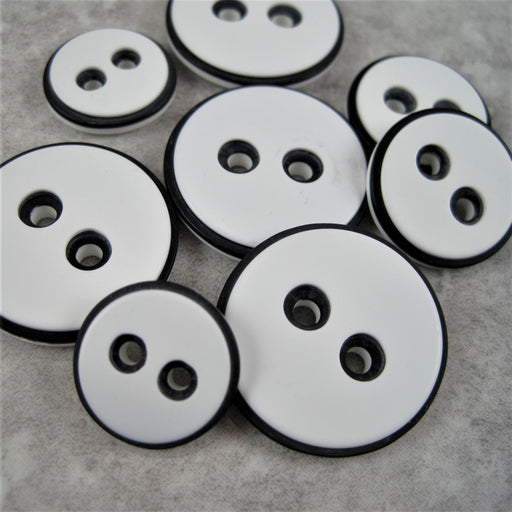 White button with black edging