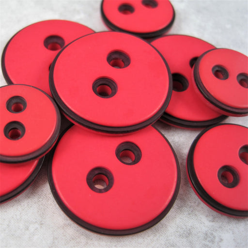 Red button with black edging