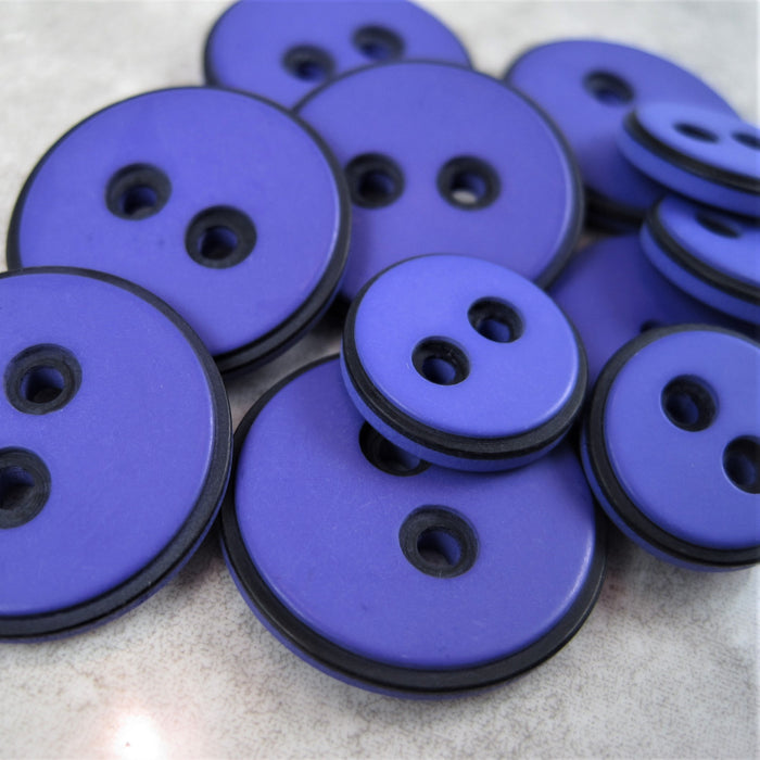 Purple button with black edging