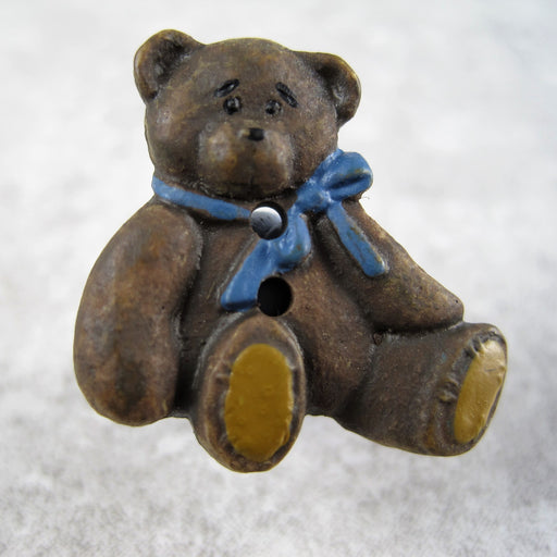 Brown bear with blue bow.