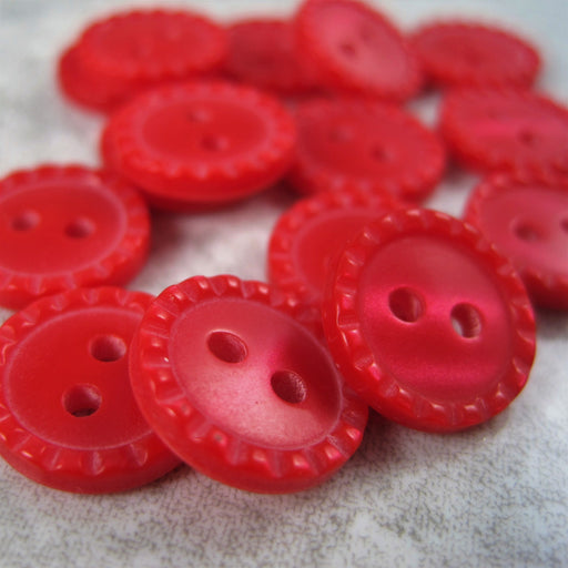 Red Baby button with ripple edge.