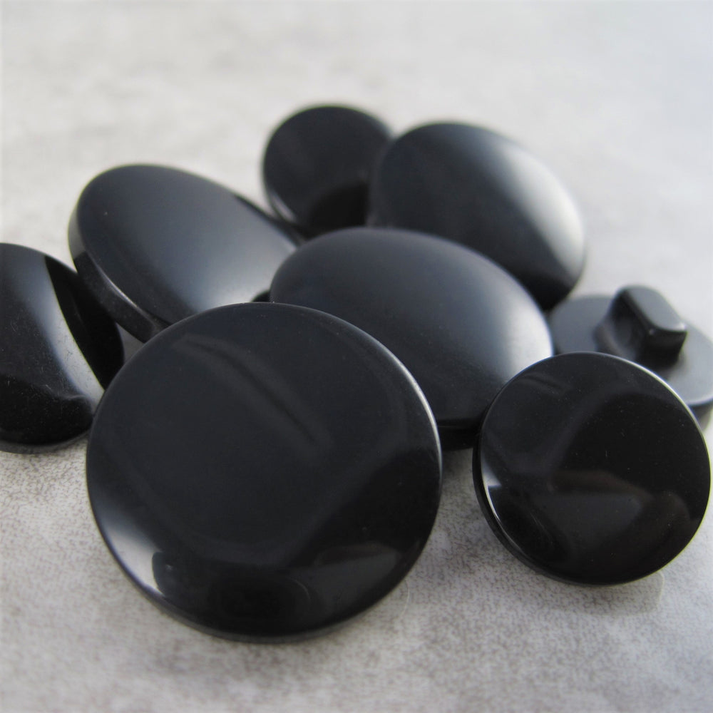 Black shiny button with sewing shank